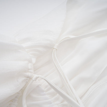 Natalia Mini Dress in White Shirred Flounce sleeveless V-neck asymmetrical hem Tencel Terylene self-tie straps slip-on thigh-length high-low silhouette