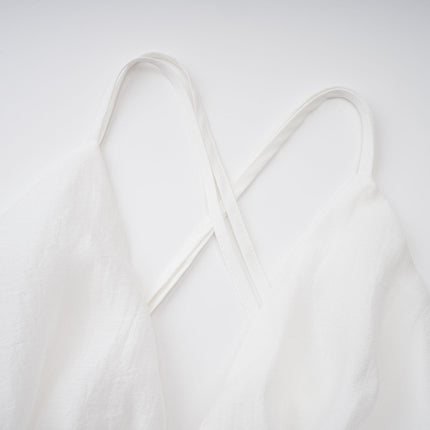 Natalia Mini Dress in White Shirred Flounce V-neck Asymmetrical Hem Sleeveless Self-tie Straps Thigh-length Tailored Cut High-low Silhouette