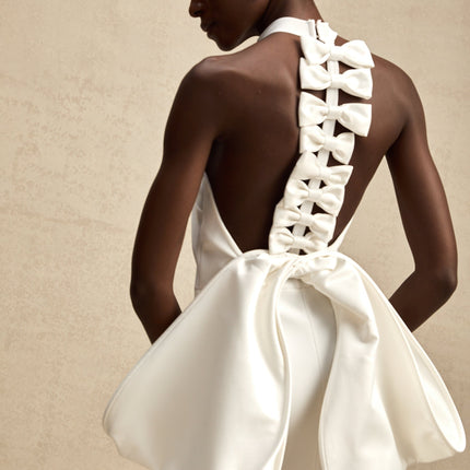 Natalia White Oversize-bow Maxi Dress with rear bowknot detail, round neck, rear slit, size zip fastening, open back design, and maxi length in 75% polyester and 25% spandex