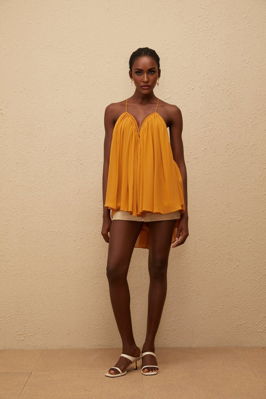 Embrace elegance in the Nemesis Ginger Pleated Chiffon Top in Orange color