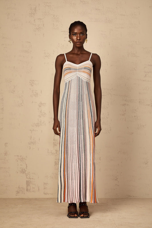 Neutral colored long maxi dress with horizontal sequin stripes knitted pattern and sleeveless design for women