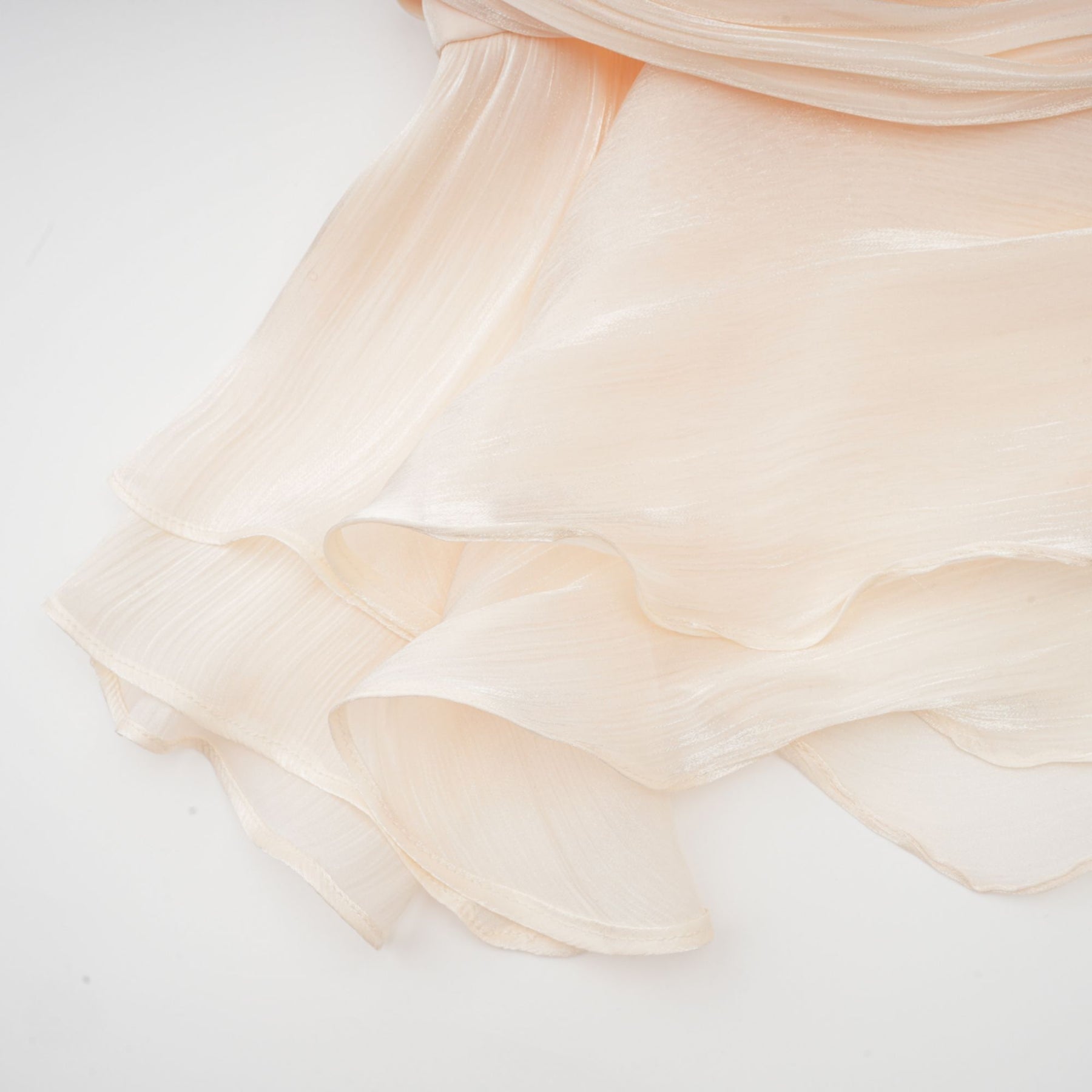 Neutral colored short dress with full pleats and ruffle details Eugenie mini dress