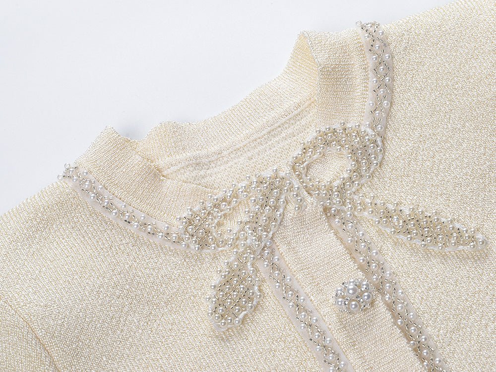 Neutrals tweed dress with crystal-embellished buttons and bow detail