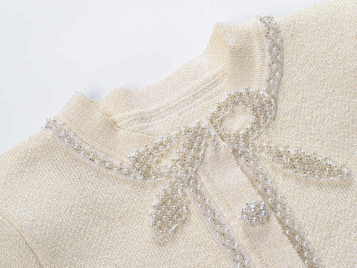 Neutrals tweed dress with crystal-embellished buttons and bow detail