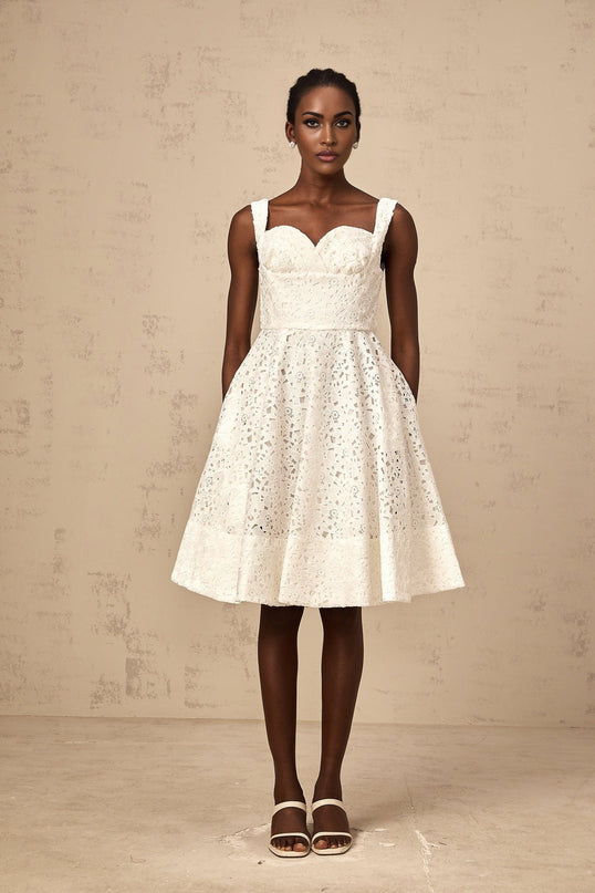 Nicolette white midi dress with delicate floral lace pattern and feminine silhouette