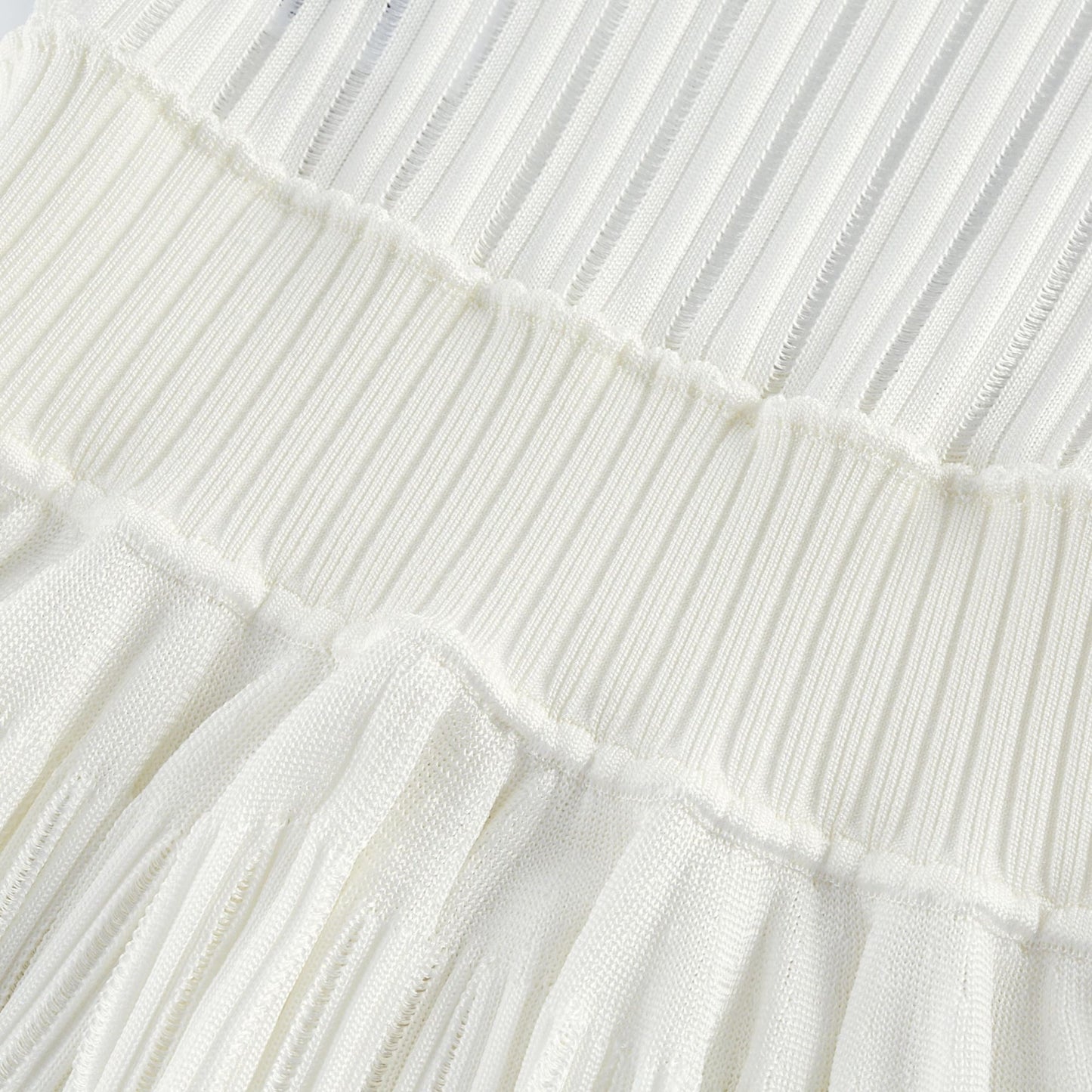 Noémie white cutout pleated mini dress