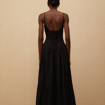 Octavia Maxi Dress in Black with White Embroidered Corset and Lace Panelling V-neck and Adjustable Straps Pleated Bodice Flounce Hem and Side Slit 100% Terylene Fiber Side Zip and Lace-up Closure