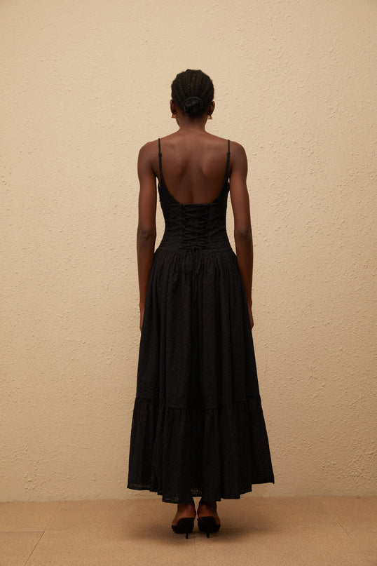 Octavia Maxi Dress in Black with White Embroidered Corset and Lace Panelling V-neck and Adjustable Straps Pleated Bodice Flounce Hem and Side Slit 100% Terylene Fiber Side Zip and Lace-up Closure