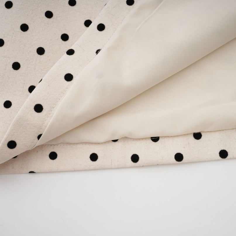 Ornella Midi Dress in White with Black Polka Dots sartorial masterpiece halterneck design open back bow embellishment polka-dot print puff skirt sophisticated silhouette bow detailing calf-length hemline rear button zip fastening special occasions classic charm contemporary style