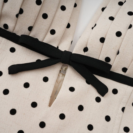 Ornella Midi Dress in White with Black Polka Dots sartorial masterpiece halterneck open back bow embellishment polka-dot print puff skirt calf-length hemline rear button zip fastening special occasions classic charm contemporary style