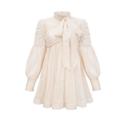 Paola Mini Dress in Neutrals sophisticated mock neck long puff sleeves tuck detailing fully pleated skirt rear zip fastening luxurious blend of Terylene fiber and Spandex