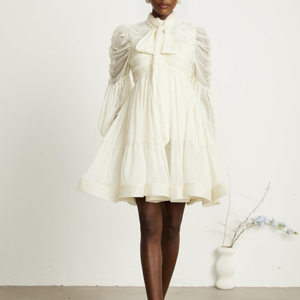 Paola Neutrals Mini Dress mock neck long puff sleeves buttoned cuffs tuck detailing gathered design pleated skirt rear zip fastening luxurious blend Terylene fiber Spandex timeless beauty