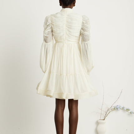 Paola Neutrals Mini Dress mock neck puff sleeves buttoned cuffs tuck detailing gathered design pleated skirt rear zip fastening thigh-length luxurious blend Terylene fiber Spandex timeless beauty