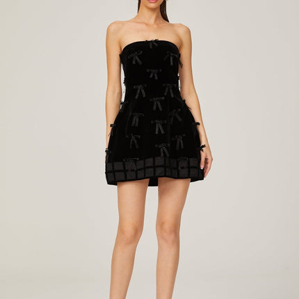 Paolina Black Mini Dress Off-the-Shoulder Bow Detail Flared Skirt A-Line Silhouette Polyester Special Occasions Evening Events Femininity Sophistication Timeless Style Luxurious Craftsmanship Wardrobe Essential