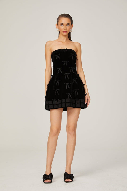 Paolina Black Mini Dress Off-the-Shoulder Bow Detail Flared Skirt A-Line Silhouette Polyester Special Occasions Evening Events Femininity Sophistication Timeless Style Luxurious Craftsmanship Wardrobe Essential