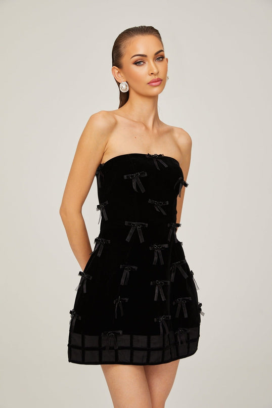 Paolina Black Mini Dress Off-Shoulder Bow Detail A-Line Silhouette Polyester Special Occasions Evening Events Feminine Sophisticated Timeless Style Luxury Craftsmanship Wardrobe Essential