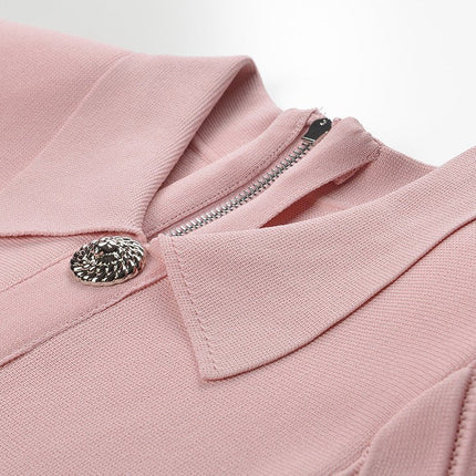 Pink A-line silhouette dress with long sleeves and decorative buttons in soft pastel shade