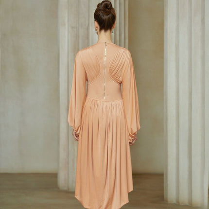 Pink asymmetrical midi dress with pleated design and Kenza branding