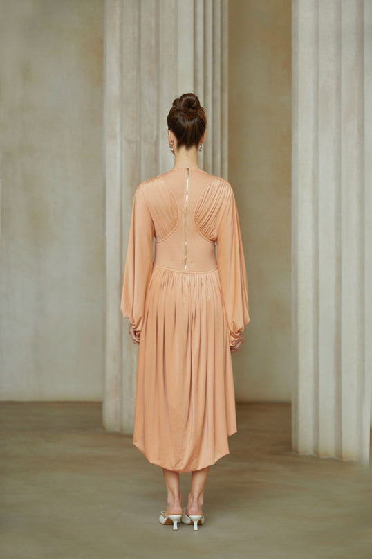 Pink asymmetrical midi dress with pleated design and Kenza branding