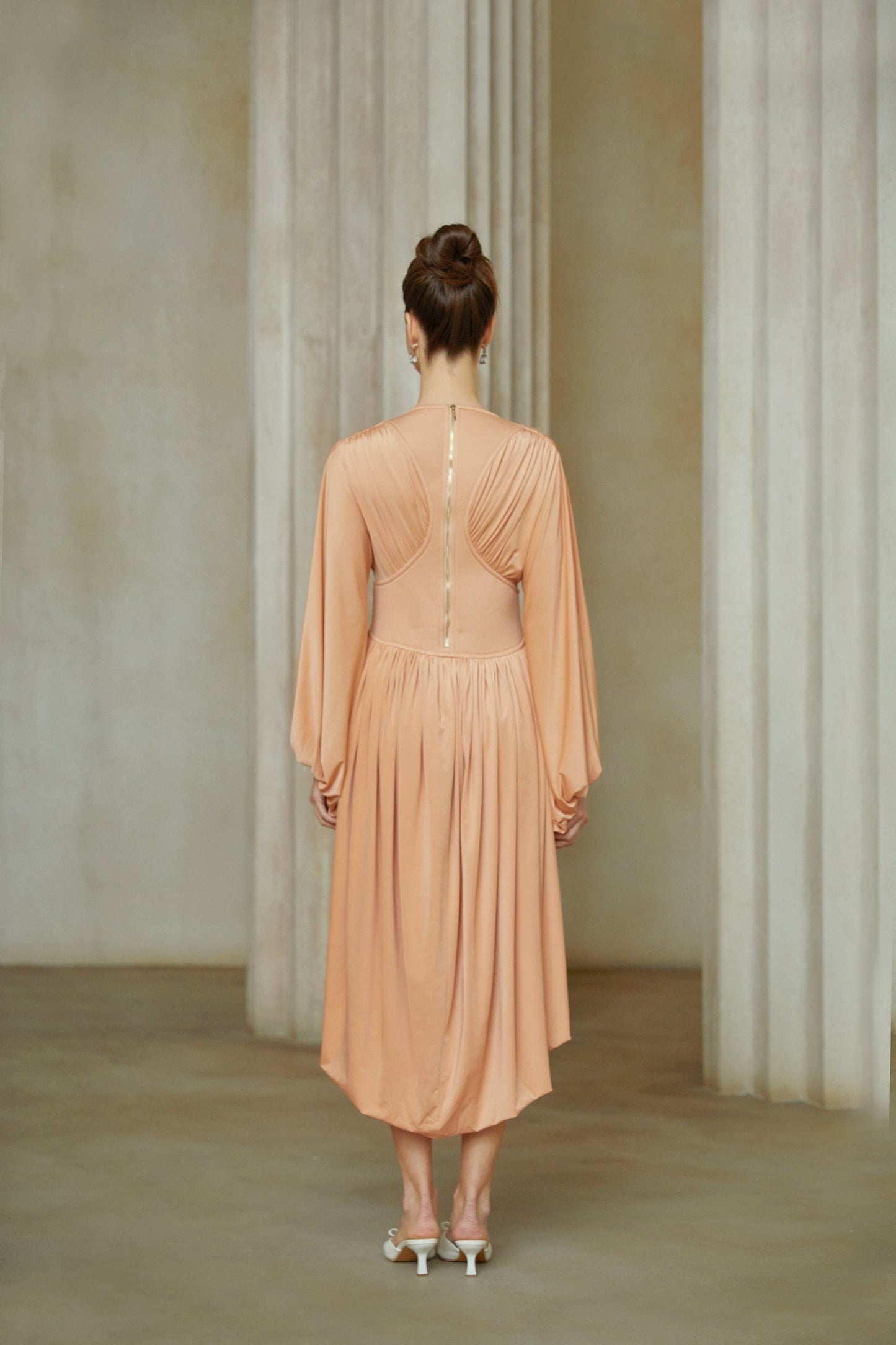 Pink asymmetrical midi dress with pleated design and Kenza branding