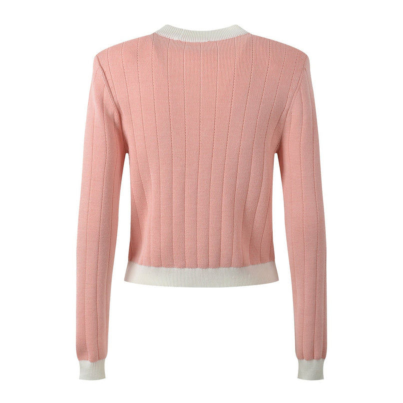 Pink cropped cardigan with ribbed texture and gold-tone buttons
