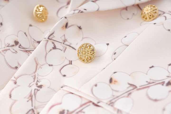 Pink Floral Blazer with Gold Buttons on Light Pastel Background