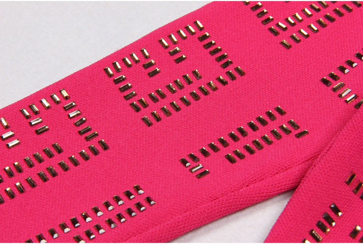 Pink geometric cutout cardigan and skirt with gold details