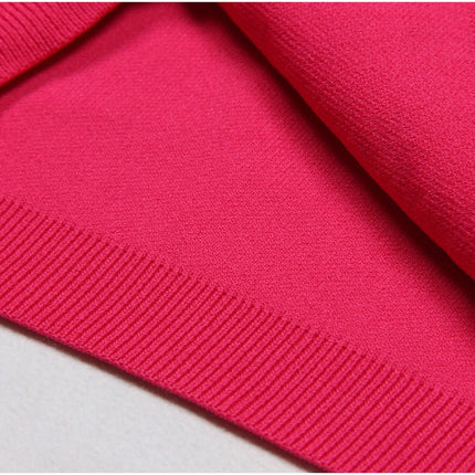 Bold pink geometric patterned cutout dress with metallic accents
