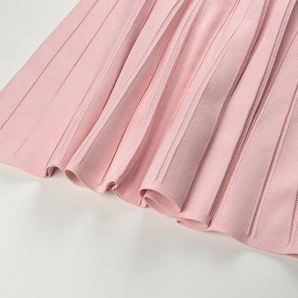 Pink knit A-line dress with pleated texture and decorative buttons