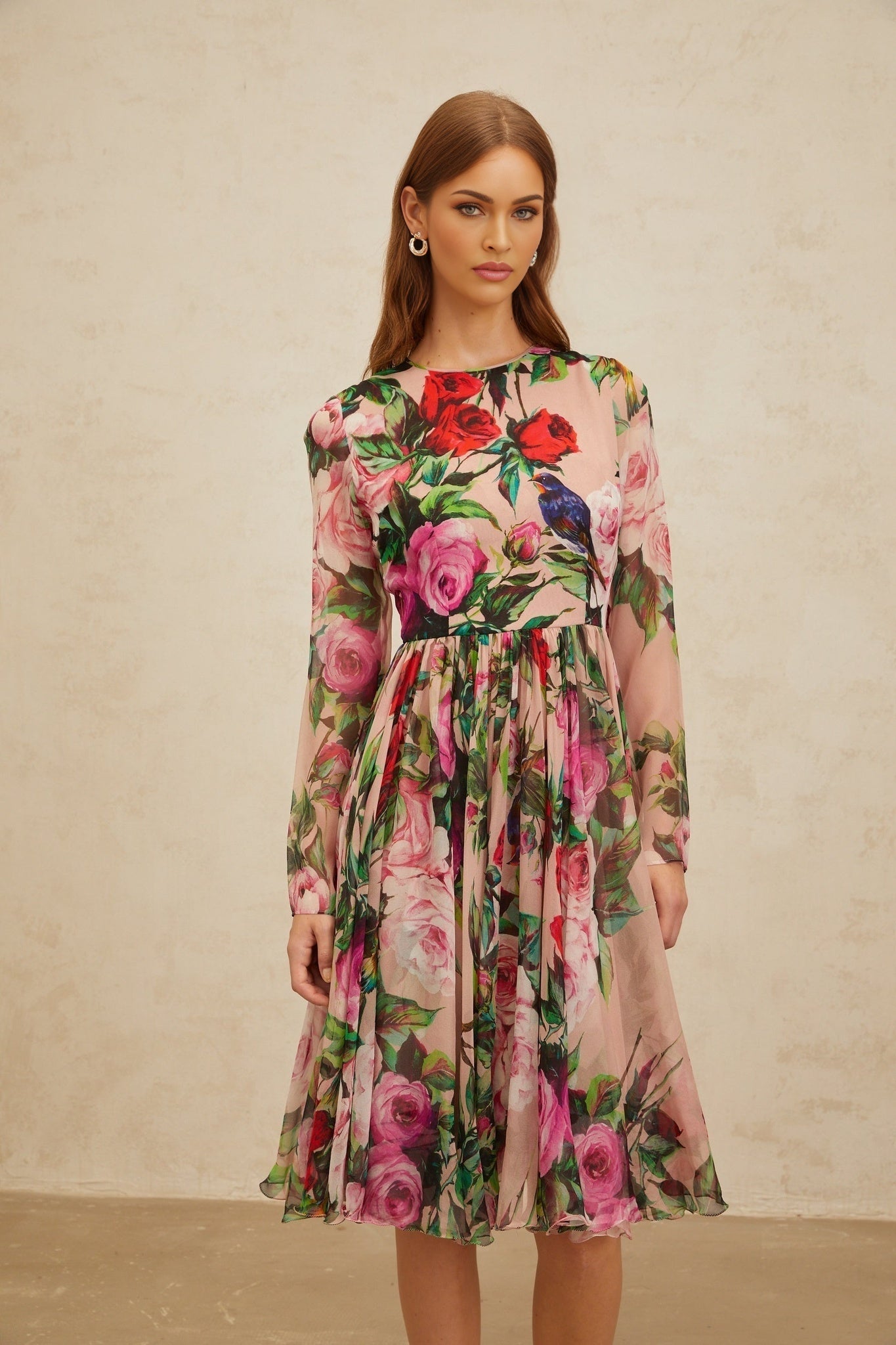 Pink long sleeve silk dress with rose print and shirred panel, rear zip fastening, midi length