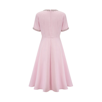 Pink midi dress with crystal accents and bow detail named Cassiopeia