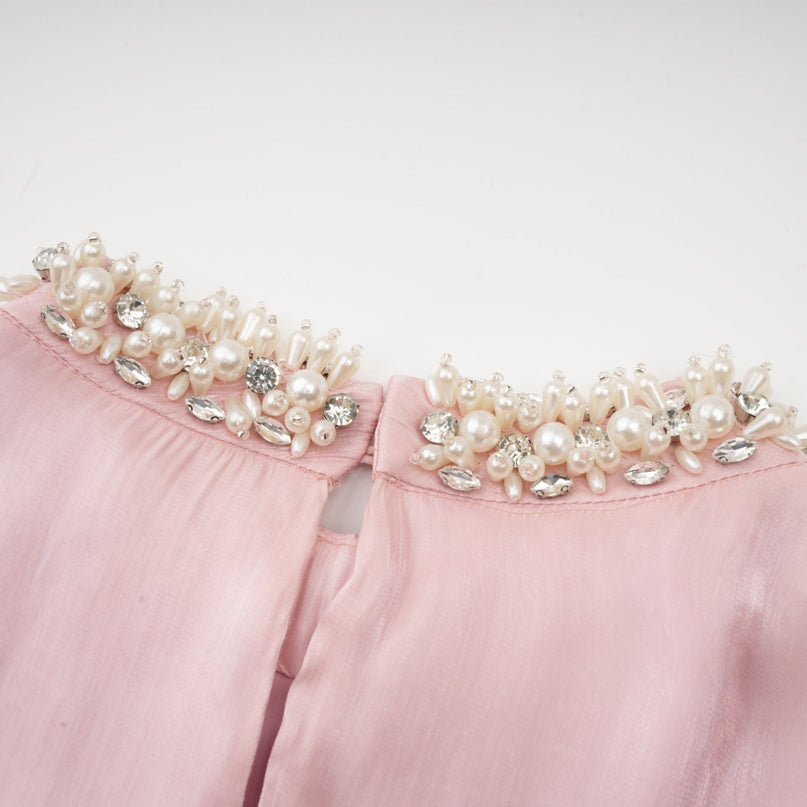 Pink mini dress with pleated skirt and embellished details named Helena