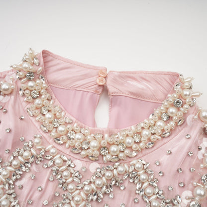 Pink mini dress with pleated skirt and embellished details named Helena