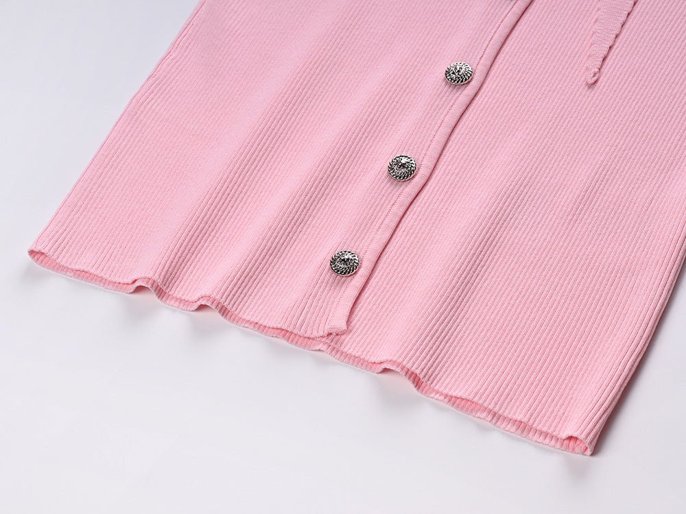 Pink ribbed button-up blouse with tie-neck detail and decorative pockets