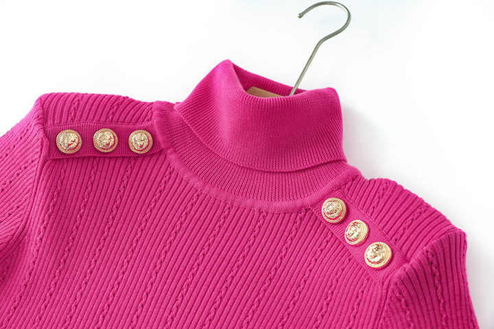 Pink ribbed knit sweater with high neck design and decorative buttons on shoulders