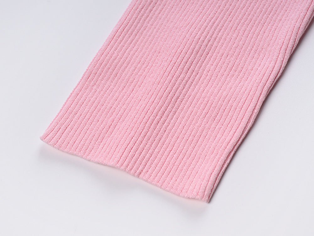 Pink ribbed slim fit blouse with tie-neck detail and buttoned front