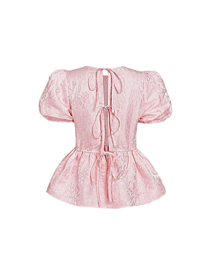 Pink jacquard blouse with puff sleeves and open back with ties
