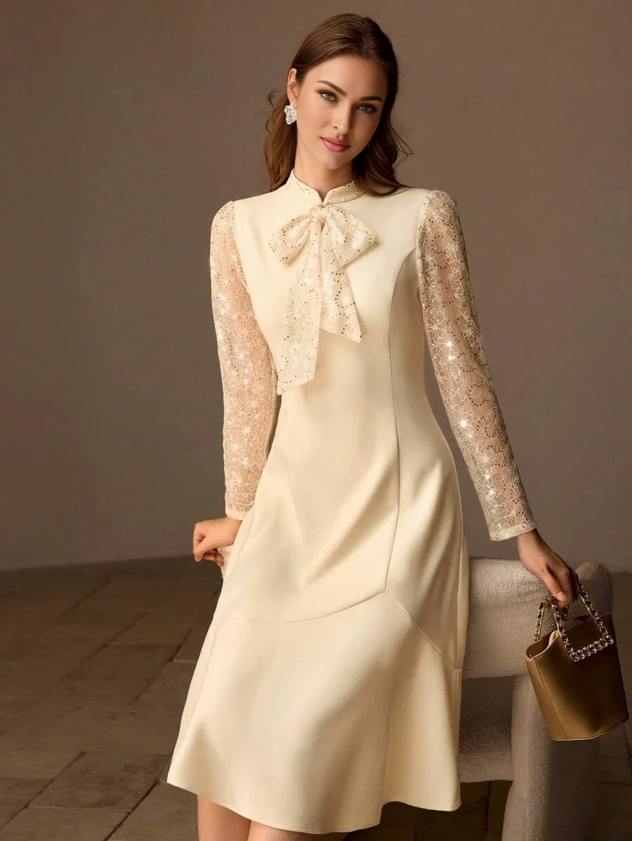 PREMIUM SEQUIN LACE PANEL BOW MOCK NECK FLARE HEM MIDI DRESS