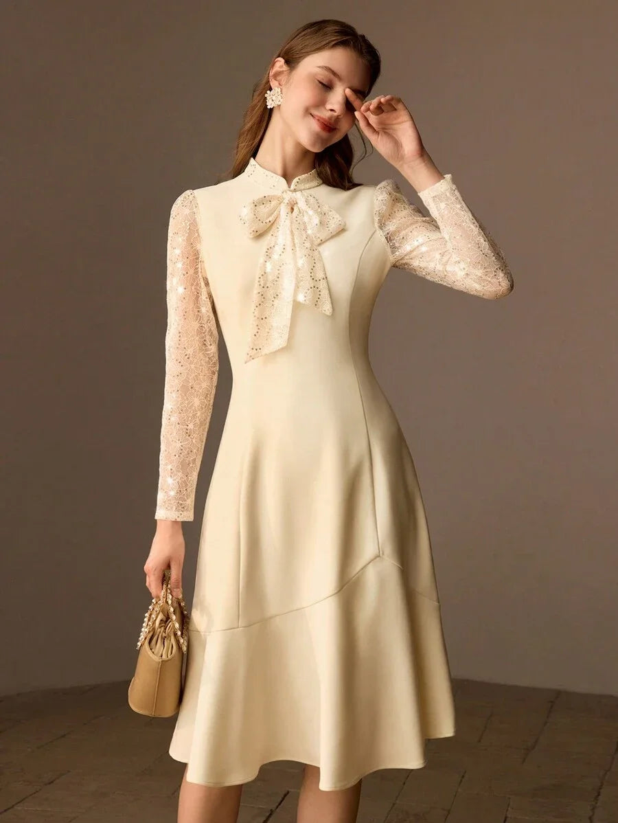 PREMIUM SEQUIN LACE PANEL BOW MOCK NECK FLARE HEM MIDI DRESS