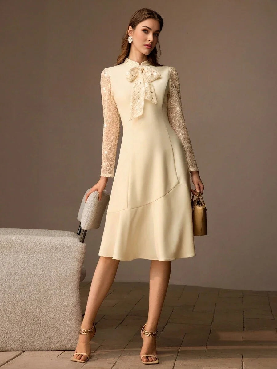 PREMIUM SEQUIN LACE PANEL BOW MOCK NECK FLARE HEM MIDI DRESS