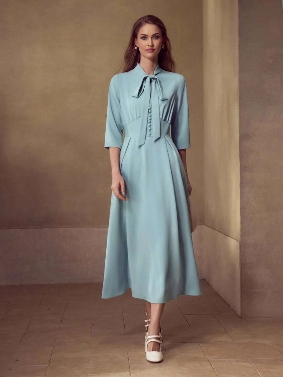 PREMIUM TIE NECK FLARED HEM DRESS