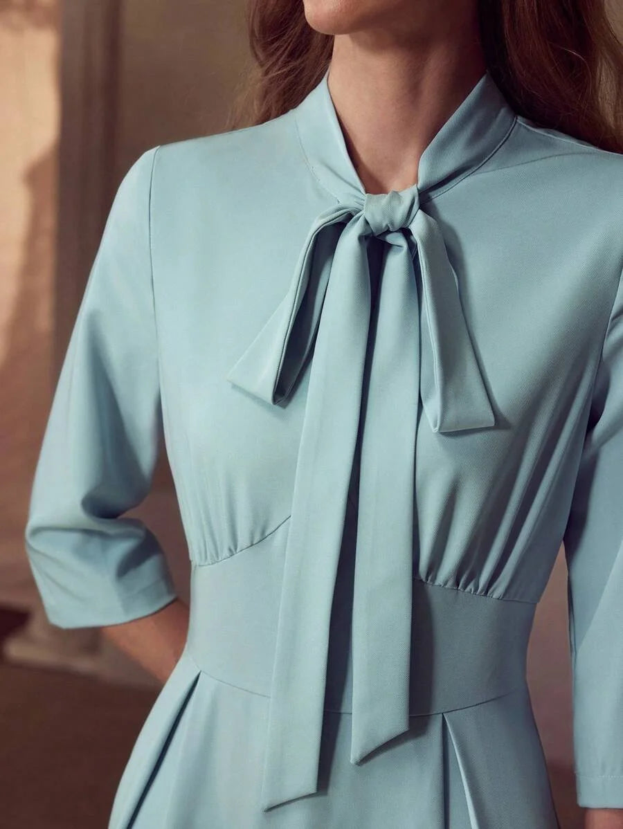 PREMIUM TIE NECK FLARED HEM DRESS