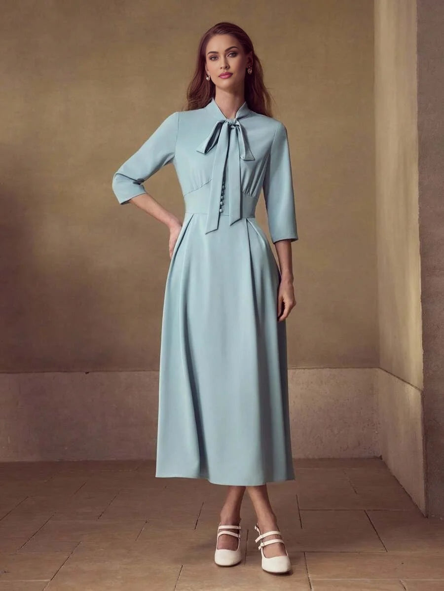 PREMIUM TIE NECK FLARED HEM DRESS