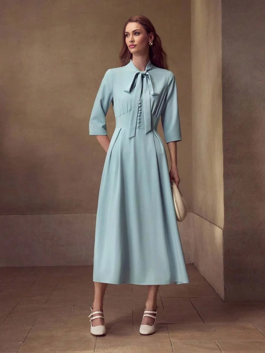 PREMIUM TIE NECK FLARED HEM DRESS