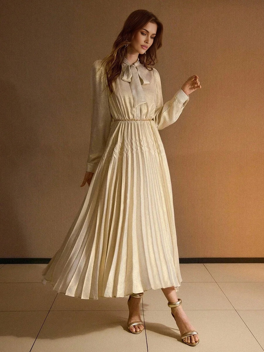 PREMIUM TIE NECK LANTERN SLEEVE PLEATED DRESS WITH CHAIN BELT