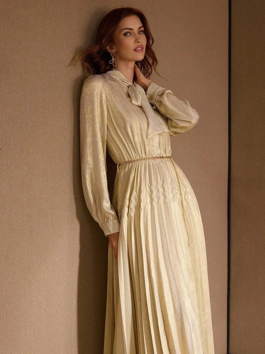 PREMIUM TIE NECK LANTERN SLEEVE PLEATED DRESS WITH CHAIN BELT