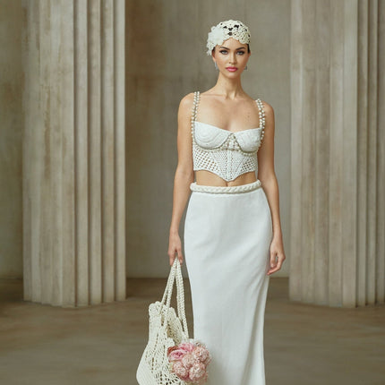 Elevate your wardrobe with the exquisite Prunelle Crochet Knit Two-Piece Top and Skirt Set in Neutrals
