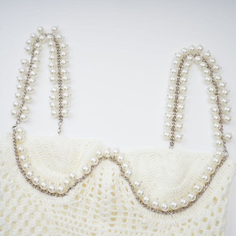 Elevate your wardrobe with the exquisite Prunelle Crochet Knit Two-Piece Top and Skirt Set in Neutrals