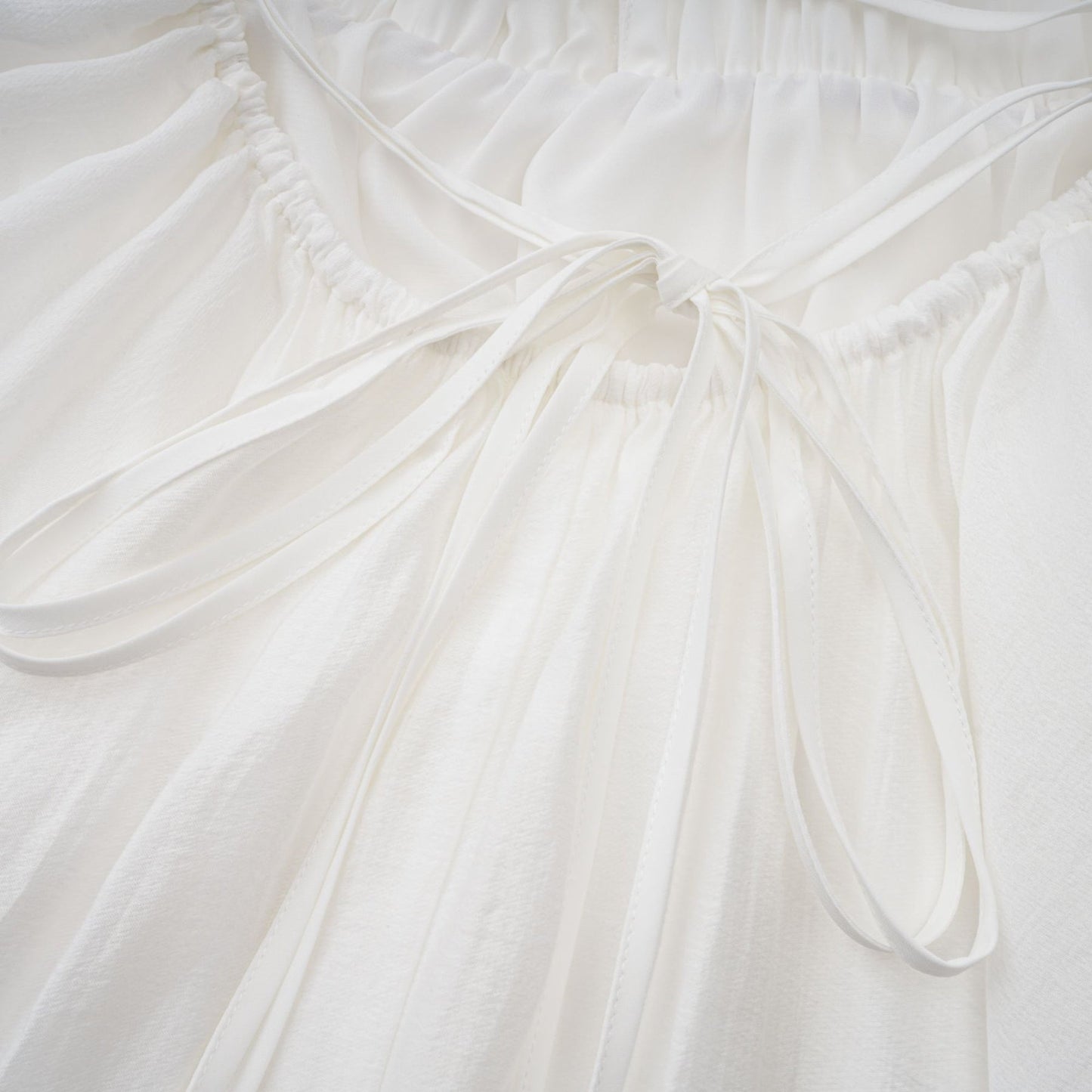 Quincie white shirred flounced mini dress