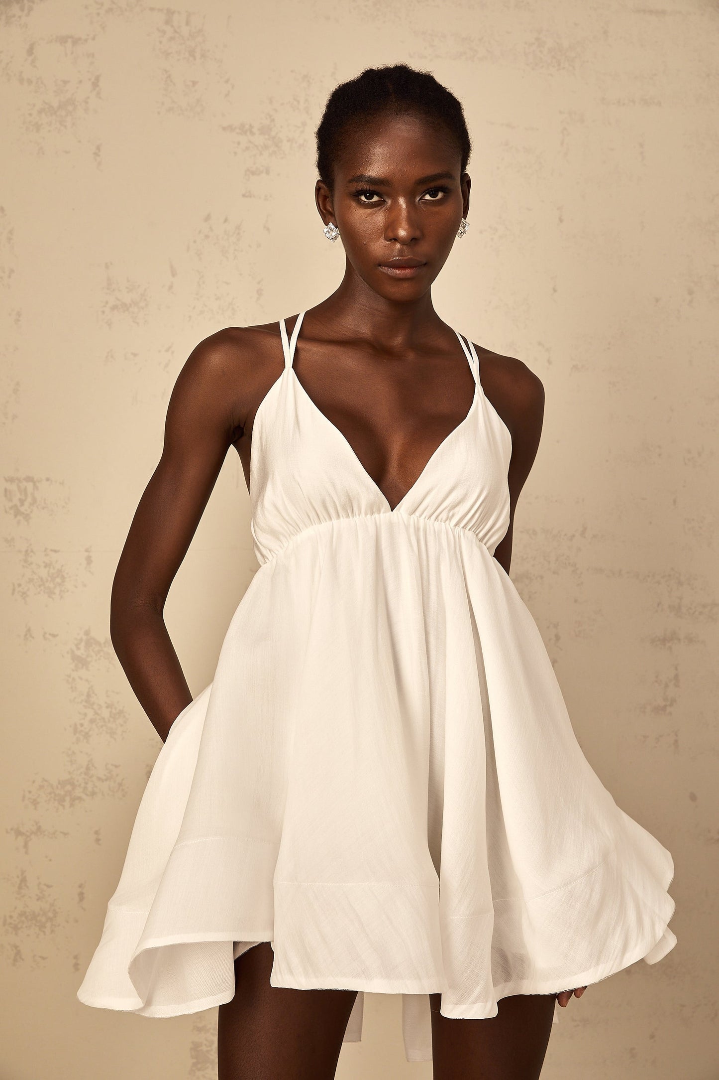 Quincie white shirred flounced mini dress